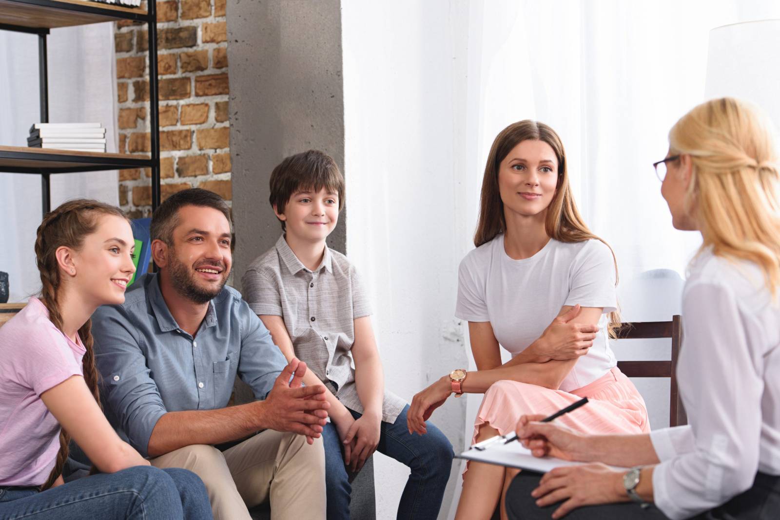 Family therapy session showing a family after making progress in reaching their goals